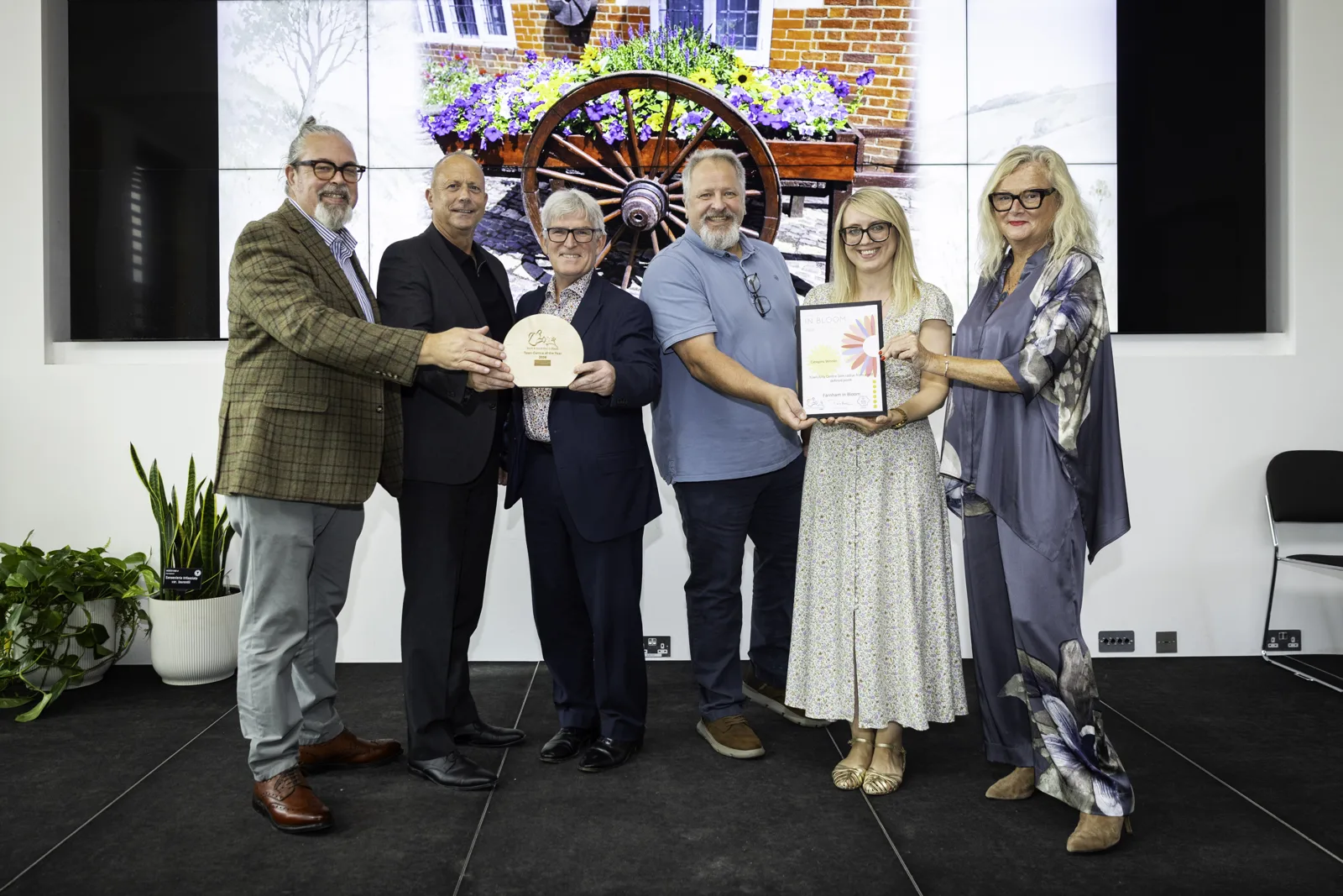 Farnham in Bloom's team with the trophy and certificate at the 2026 South & South East in Bloom awards on 25 September